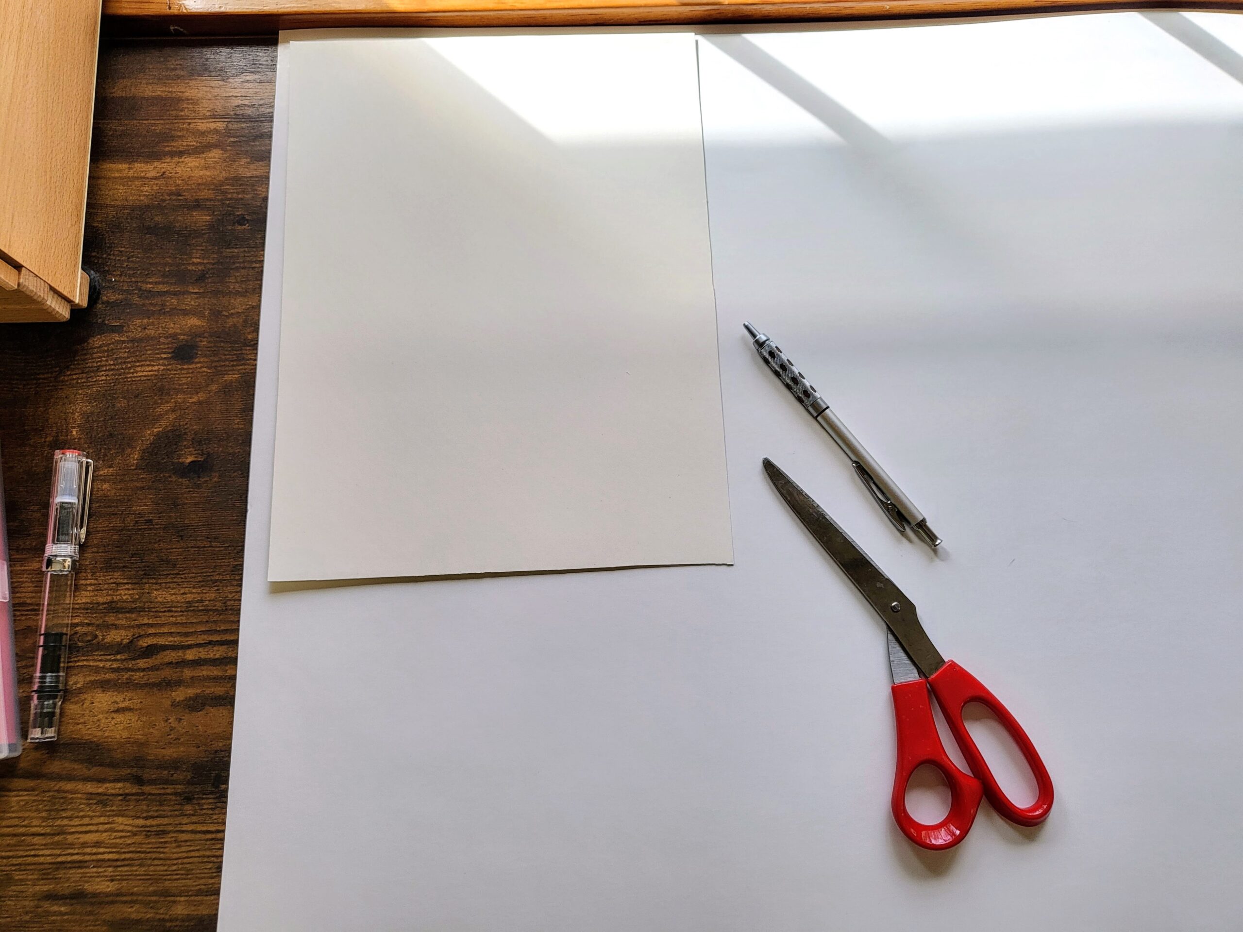 I just trace a piece of 9x12 on the back of the large sheet and cut it with scissors. It's very quick and easy. I can get 9 pieces of 9x12 this way.